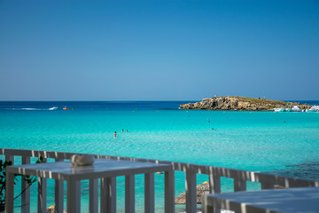 Fototapeta premium Picturesque terrace on the coast of the azure sea.