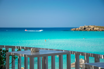 Picturesque terrace on the coast of the azure sea.