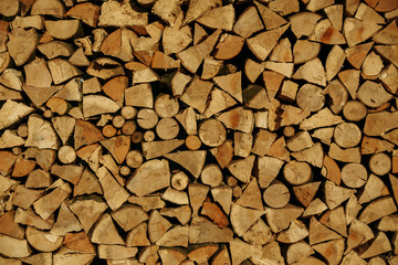 firewood chopped and stacked in rows