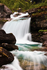 Small Misty Forest waterfall in Trollveggen Norway 