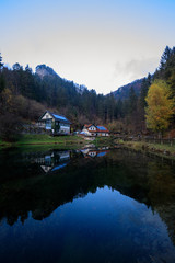 Wooden bridge over cascade falls over mossy rocks at Myrafalle, near Muggendorf in Lower Austria