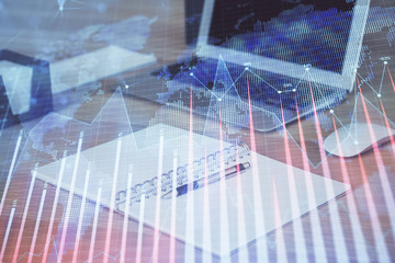 Double exposure of forex chart and work space with computer. Concept of international online trading.