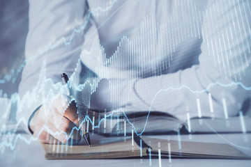 Fototapeta premium Financial trading chart multi exposure with man desktop background.