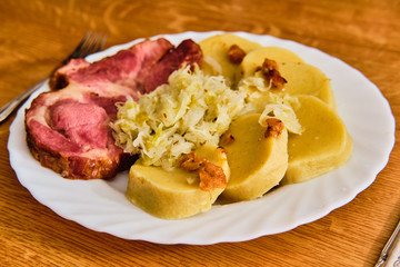 Czech smoked meat with gabbagge and potato dumplings
