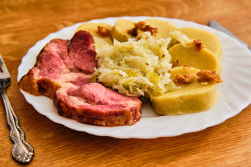 Czech smoked meat with gabbagge and potato dumplings