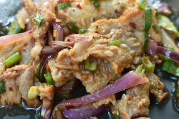  spicy roasted pork Thai salad eat with fresh basil leaf and cabbage on plate