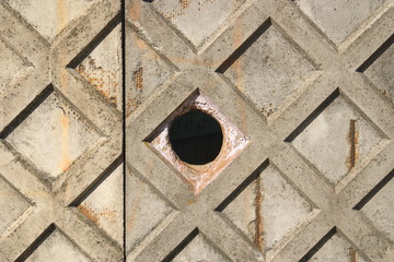 Image of a concrete wall with a round hole