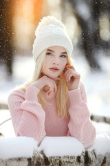 Beautiful young woman in winter forest