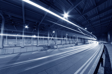 light trails and head lights of traffic in tunnel. Transportation background