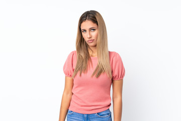Fototapeta premium Young blonde woman over isolated white background with sad and depressed expression