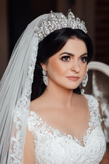 Kind of bride girl in veil and jewelry at home, romantic atmosphere of the bride's morning. Wedding...