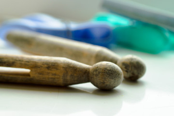Wooden clothes pegs for hanging washing close up isolated