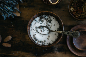 Making lavender salt in a wooden bowl