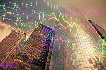 Forex chart on cityscape with skyscrapers wallpaper multi exposure. Financial research concept.
