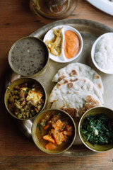Top view of Nepali vegetarian set. Bowls with different curry