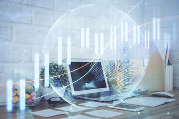 Financial market graph hologram and personal computer on background. Double exposure. Concept of forex.