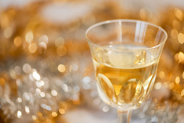 Glass of Champagne with a Christmas background
