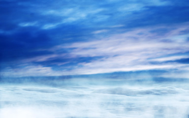 Background of a winter landscape. Snow covered road, fog. Reflections of the neon glow in the sky.