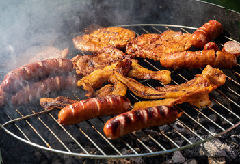 Unhealthy but tasty grilled sausages and meat