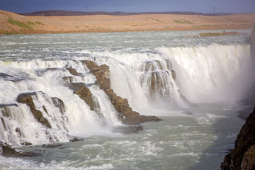 Fototapeta na wymiar Landscape with big majestic Gullfoss waterfall in mountains in Iceland