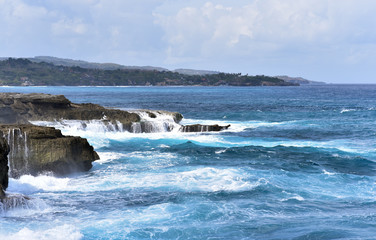 Devil's Tears Nusa Lembongan is a cliffside cove where huge waves crash against the rocks and explode back out into thesea, Nusa Penida, Indonesia