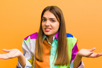 young pretty woman feeling clueless and confused, not sure which choice or option to pick,...