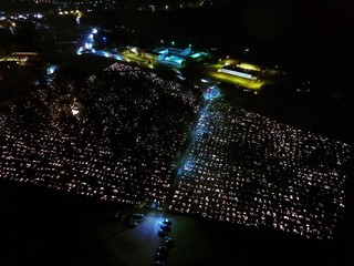 All Saints' Day. Cemetery full of candles. Drone footage.