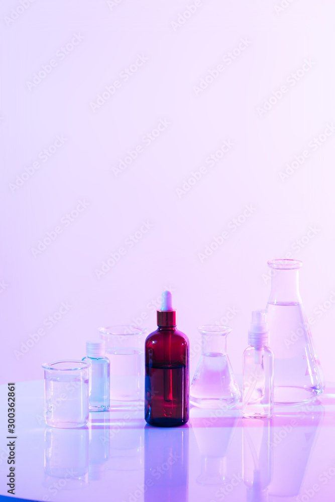 Wall mural retro brown bottle with flask in science laboratory background