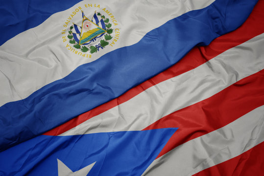 waving colorful flag of puerto rico and national flag of el salvador.