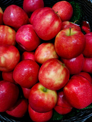 Red apples in the supermarket background