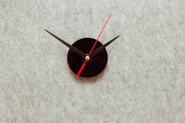 Clock hands on gray background. Minimal time concept