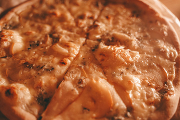 delicious fresh homemade pizza on the table. pizza with pear and green blue cheese