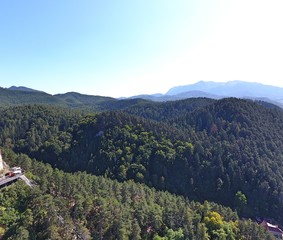 Fototapeta premium On the top of the city. Drone footage. Romanian mountains.