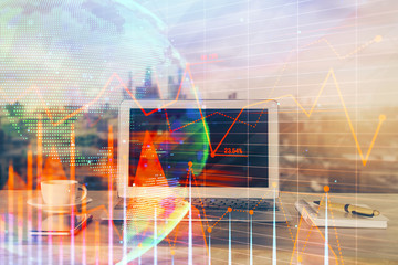 Stock market graph and table with computer background. Multi exposure. Concept of financial analysis.