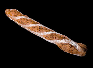 French rye baguette isolated on a black background