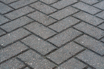 Texture of road tiles with herringbone pattern