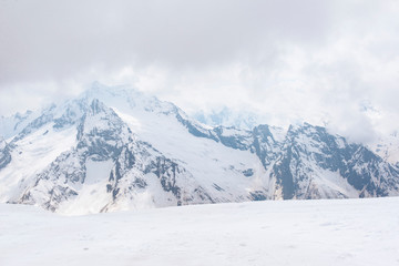 Fototapeta na wymiar view of snowy mountains in winter, Caucasus, winter mountain landscape, Russia