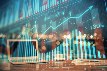 Double exposure of chart and financial info and work space with computer background. Concept of...