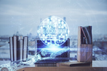 Multi exposure of blockchain theme hologram and table with computer background. Concept of bitcoin...