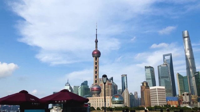 Time-lapse or Hyper-lapse View of Oriental Pearl Tower and Financial Center in Pudong. Shanghai Tower and Residential Buildings on the  Bund or Waitan on Huangpu River.