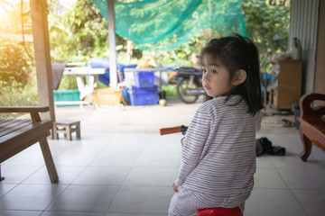 Happy child riding a bike enjoying summer 