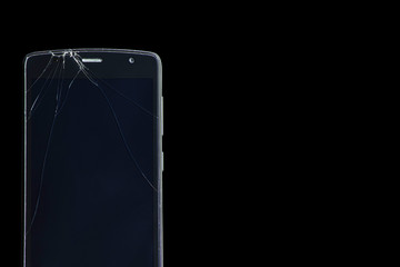 Broken smartphone screen on a black background