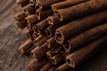 close up view of cinnamon sticks on wooden rustic table