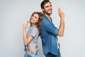 Fototapeta premium Portrait of happy couple isolated on white background. Attractive man and woman being playful.