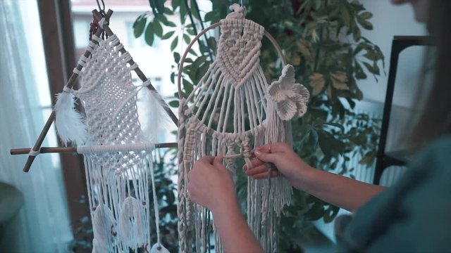 Woman is making macrame. Handmade hobby, creative decoration element, ornament design. Business woman, textile. 