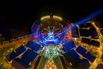 Aerial view of Legend Siam with symphony light show at night, Pattaya Thailand. Select focus.