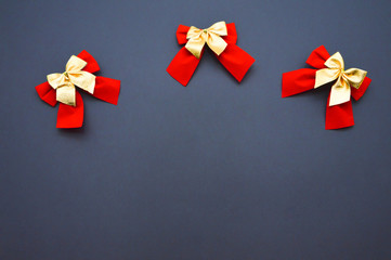 decorative bows on a plain background. red and gold bows.