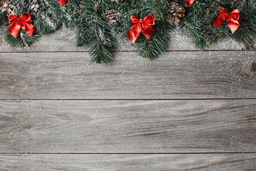 Christmas background with fir tree and decoration on wooden board