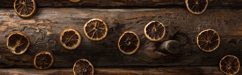 top view of dried citrus slices on wooden background, panoramic shot