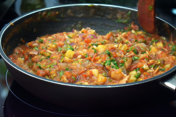 cooking vegetable sauce in a pan